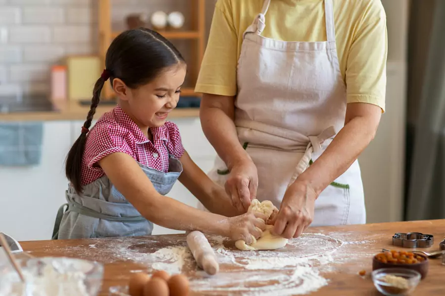 front-view-grandma-girl-cooking-together